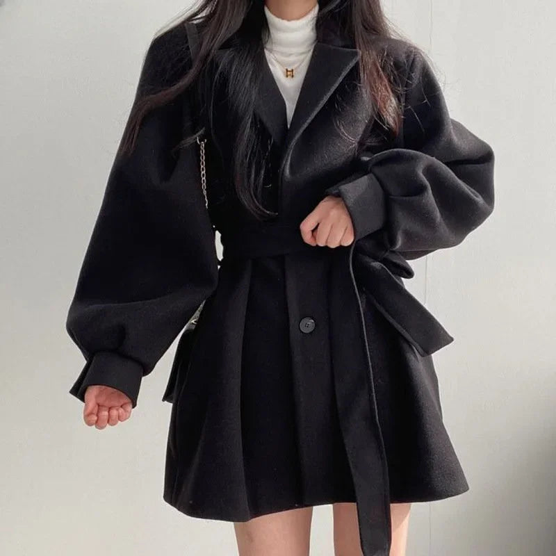 Short black winter coat back view